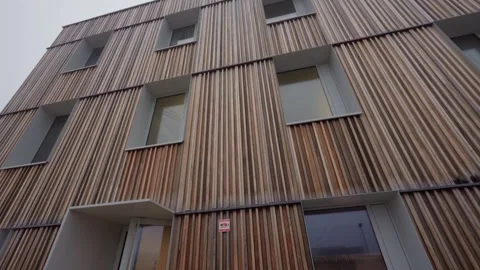 Building with a modern sustainable timber facade eco-friendly construction Stock Footage 331430366