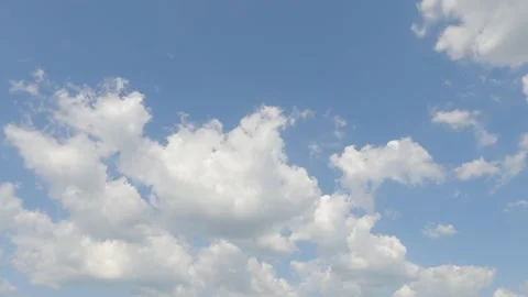 Building motion clouds on beautiful sunny clear blue sky background Stock Footage 153672677