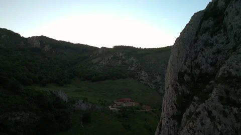 Building in a mountain valley during dusk Stock-Footage 345165995