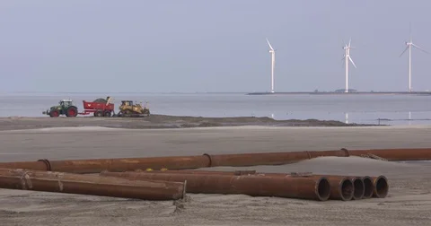 Building with nature - creating a salt marsh - dredging pipes and shovel Stock Footage 80669437