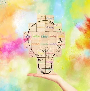 Building a new creative idea. brick wall with drawn lightbulb Stock Photos