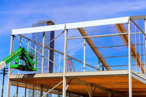 Building office is framed by metal structures made of steel beams when it is Photos
