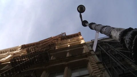 Building with old fire escape in New York Stock Footage 104880481
