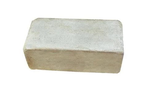 Building, one white silicate brick isolated on white background. Fotos de archivo
