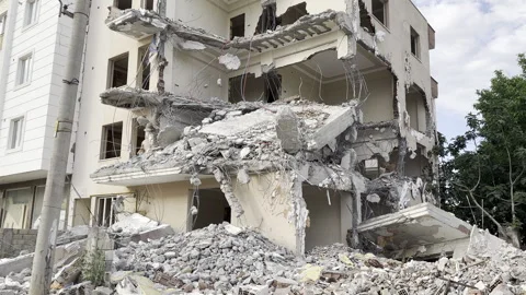 A building or structure that was half destroyed, destroyed. Stock Footage 243128561
