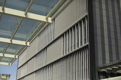 Building is outside. Windows in building. Vertical lines in architecture. Stock Photos