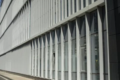 Building is outside. Windows in building. Vertical lines in architecture. Stock Photos
