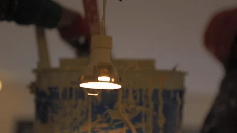 Building painter worker dipping his brush in a bucket filled with fresh paint Stock-Footage 110771531