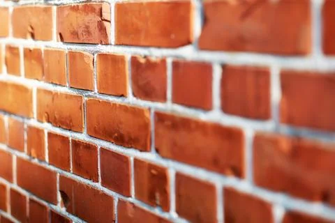 Building, pattern and closeup of brick wall in city for texture, background and Fotos de archivo