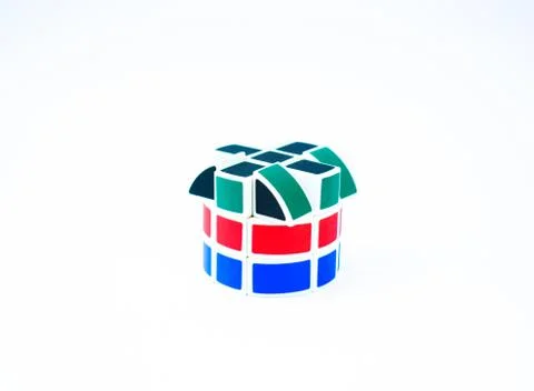 Building pattern made with a cylinder shaped Rubik cube displayed on a white Stock Photos
