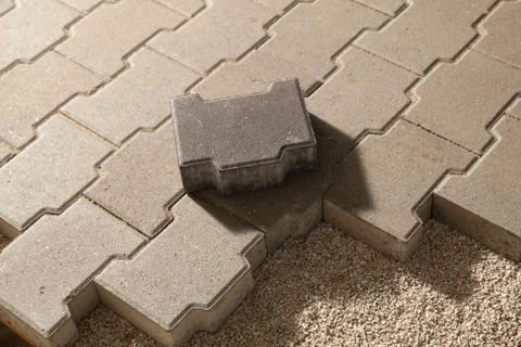 Building an pedestrian path with paver bricks. Sidewalk pavement Stock Photos