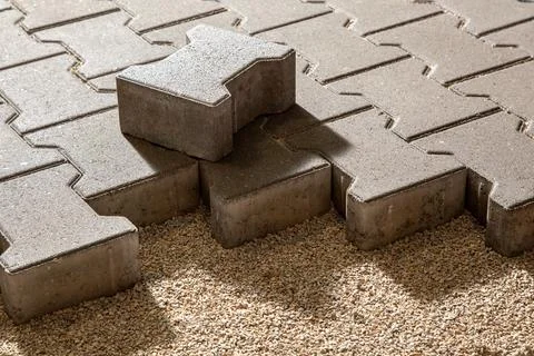 Building an pedestrian path with paver bricks. Sidewalk pavement. Process o.. Stock Photos