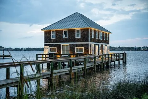 Building with pier by the Halifax River in Ormond Beach, FL Stock Photos
