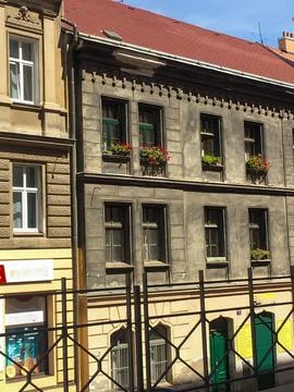 A building with planters on the window. Stock Photos