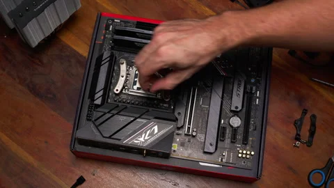 Building a powerful gaming PC. Hands installing CPU cooler on motherboard Stock Footage 301636389