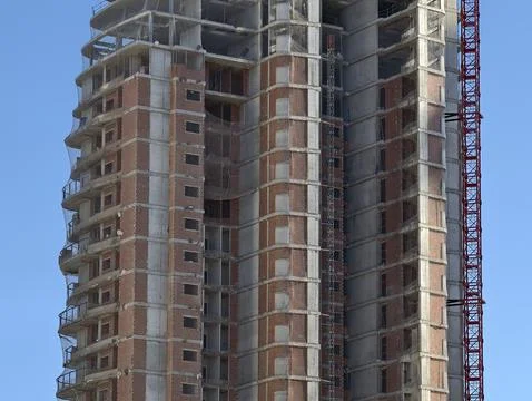 Building in progress, ongoing building process with exposed structures and Stock Photos