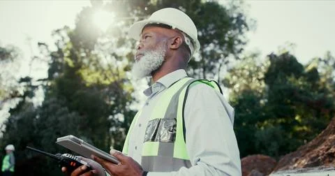 Building, radio and tablet with developer black man on excavation site for Stockfoto's