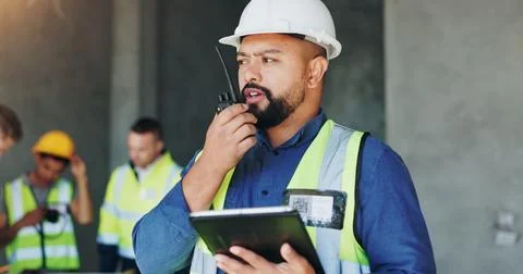 Building, radio and tablet with developer man on site for civil engineering or Stock Photos