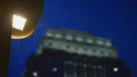 Building on a rainy night Stock Footage 99916282