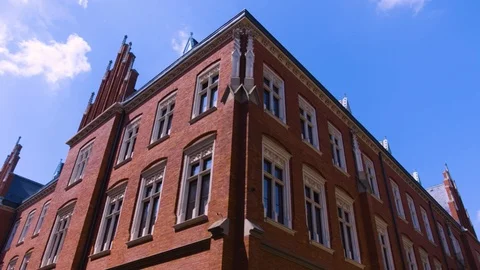 Building red brick facade on the crowded square Stock Footage 125248440