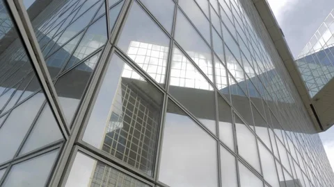 Building reflected on glass skyscraper from left corner in Paris with low camera Видео 110691972
