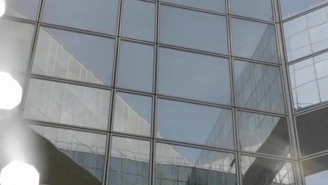 Building reflected on glass skyscraper with light flare in Paris, grey Stock-Footage 110692440