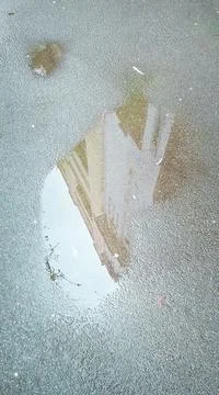 Building Reflection in Pubble Stock Photos