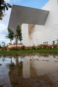 Building reflection in puddle water Stock Photos