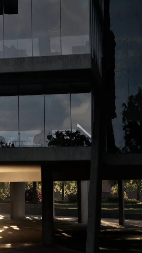 Building reflects evening light with trees in background near urban area Stock Footage 340273525