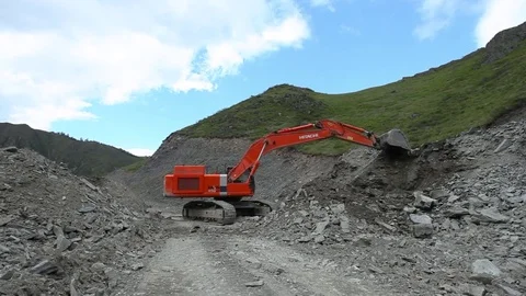 Building road deep in the mountains. Mountain Road Construction 스톡 동영상 84057161