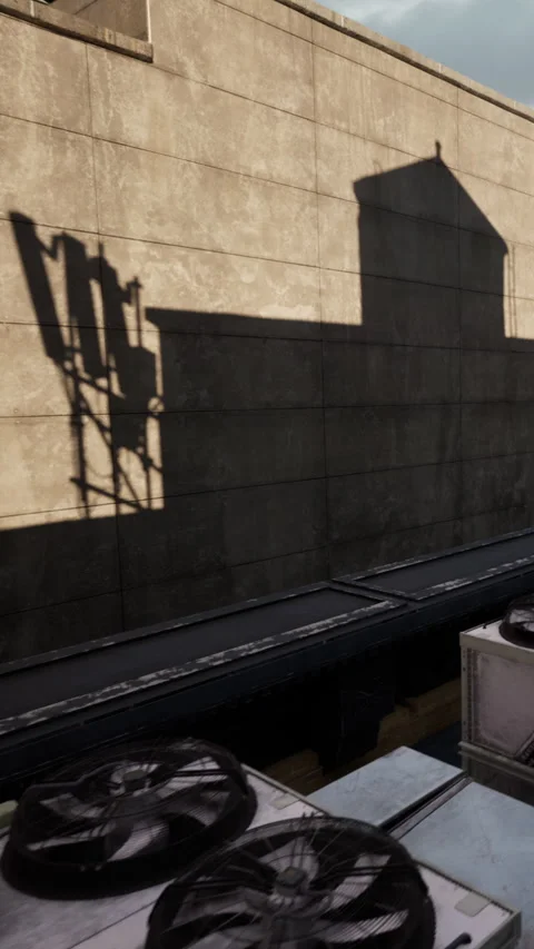 Building rooftop with equipment and shadow on wall in urban area Stock Footage 340647208
