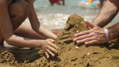 Building sand castle. 4K. Stock-Footage 76955135