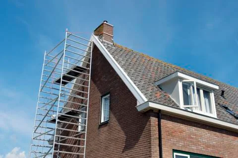 Building in scaffolding Stock Photos