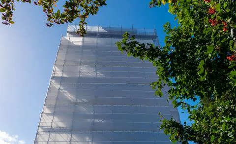 Building in scaffolding	 Stock Photos
