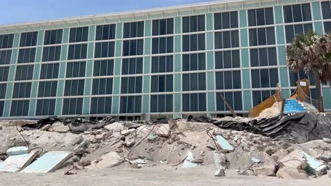 Building sea wall damaged by hurricane Nicole Stock Footage 237129357