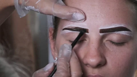 Building the Shape of Eyebrows, Tint Procedure of Natural Henna, Beauty Salon Stock Footage 212780123