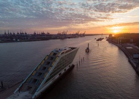 Building with a shape of a ship on a sunset Stock Photos