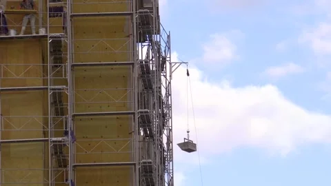 Building sheathing work on construction scaffolding 動画素材 286991757