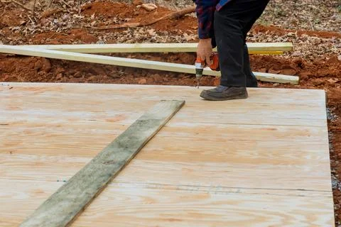 Building a shed deck foundation using wood framing beams and stick framework is Fotos de archivo