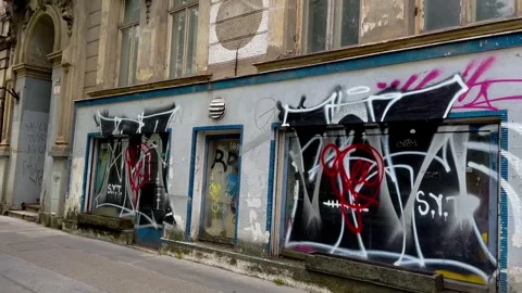 Building with shop window painted by sprayers. Stock Footage 241507971