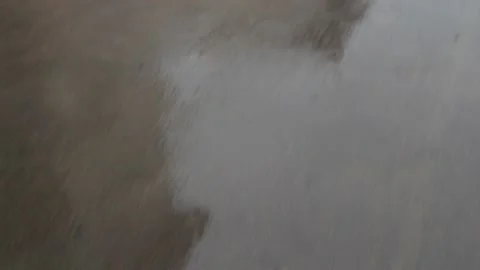 Building silhouette reflection in grey wet asphalt road Stock Footage 135371957