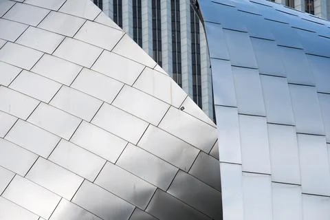 A building with a silver roof has a pattern of squares Stock Photos