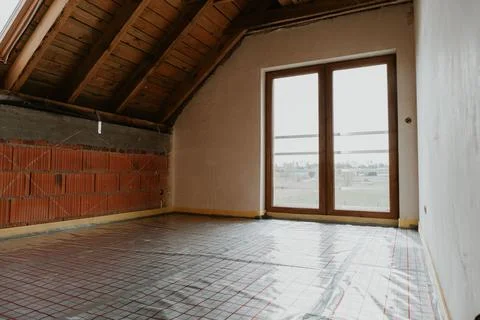 Building site, basic stage house with thermal foil for underfloor heating Fotos de archivo