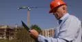Building Site Engineer Hold Clipboard Check Plans Talk Cellphone Incoming Call 4k or 4k+ Resolution