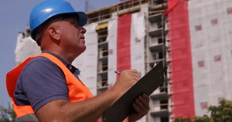 Building Site Engineer Take Clipboard Notes Supervising Workers Team Activity Stock Footage 66896046