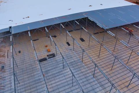 In the building site of the warehouse under construction, a metal frame steel Stock Photos