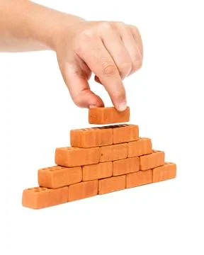 Building a small brick wall Stock Photos