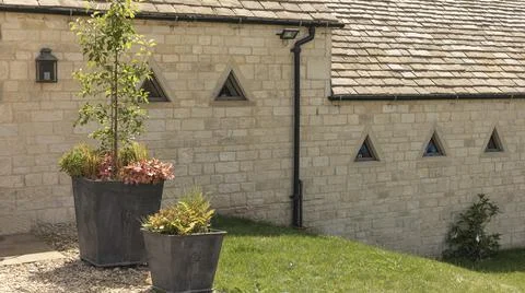 Building with small triangle shaped windows Stock Photos