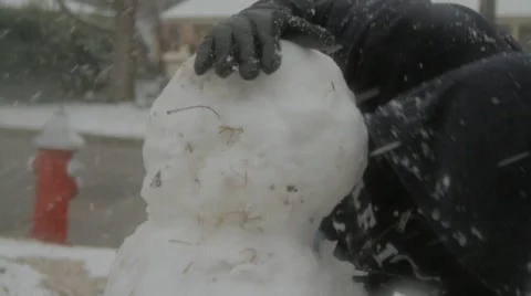 Building a snowman Stock Footage 768075