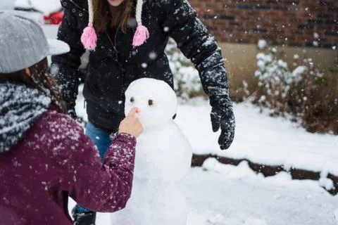 Building a snowman Stock Photos